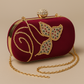 Mehroon embroidered oval shape hand clutch with sling